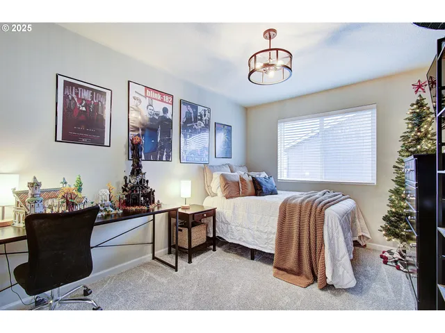 a living room with a couch and a potted plant