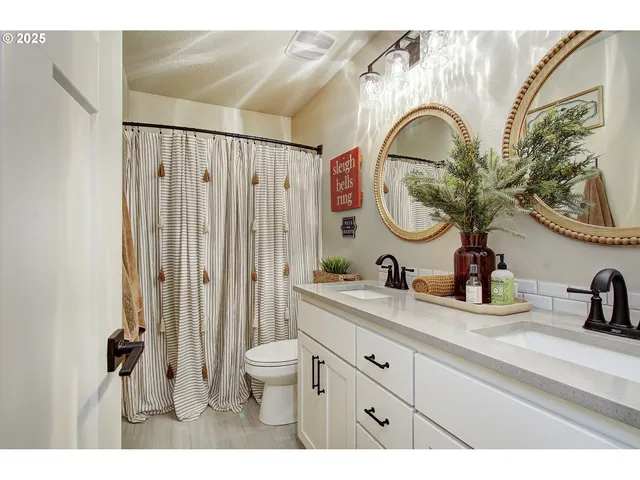 a bathroom with a sink a mirror and a toilet