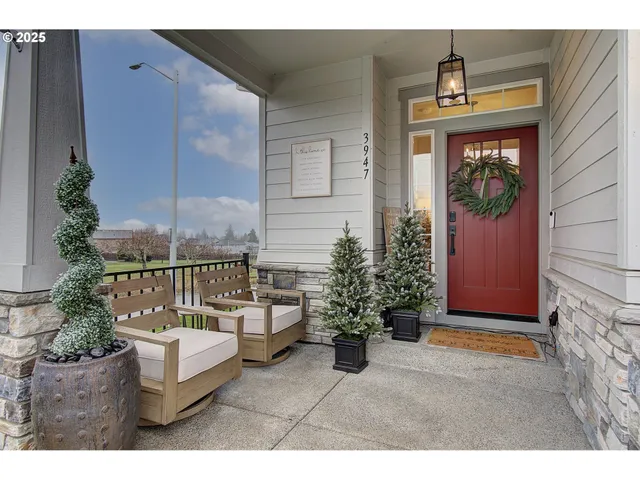 a balcony with furniture and potted plants