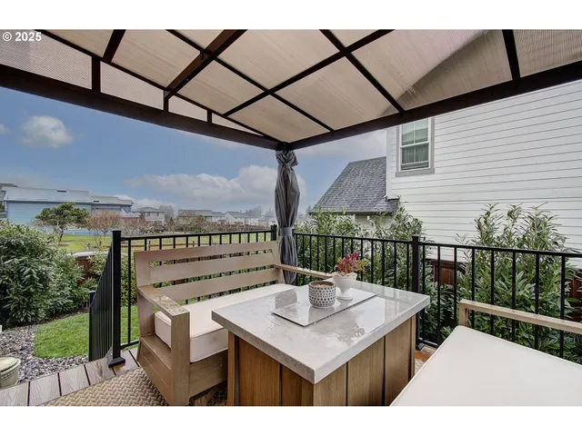 a view of a balcony with furniture