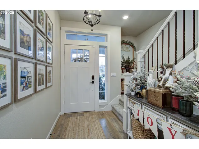 a view of an entryway with wooden floor
