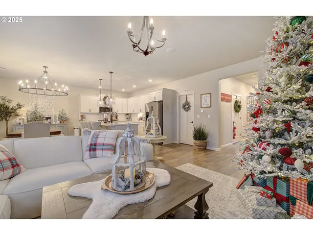 a living room with furniture and a chandelier