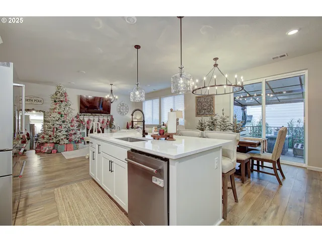 a kitchen with a sink and stove