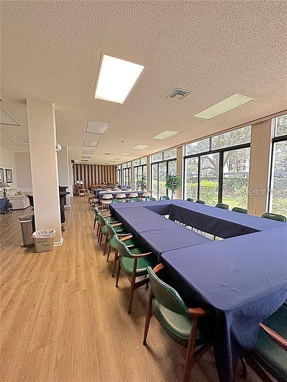 660 Island Way, Unit 607 Clearwater, FL 33767 - Photo 28 of 49 a view of a dining room with furniture window and wooden floor
