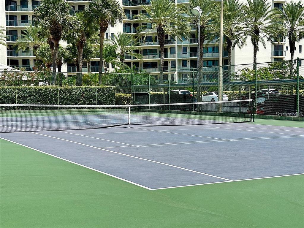 660 Island Way, Unit 607 Clearwater, FL 33767 - Photo 39 of 49 a view of a tennis ground with large trees