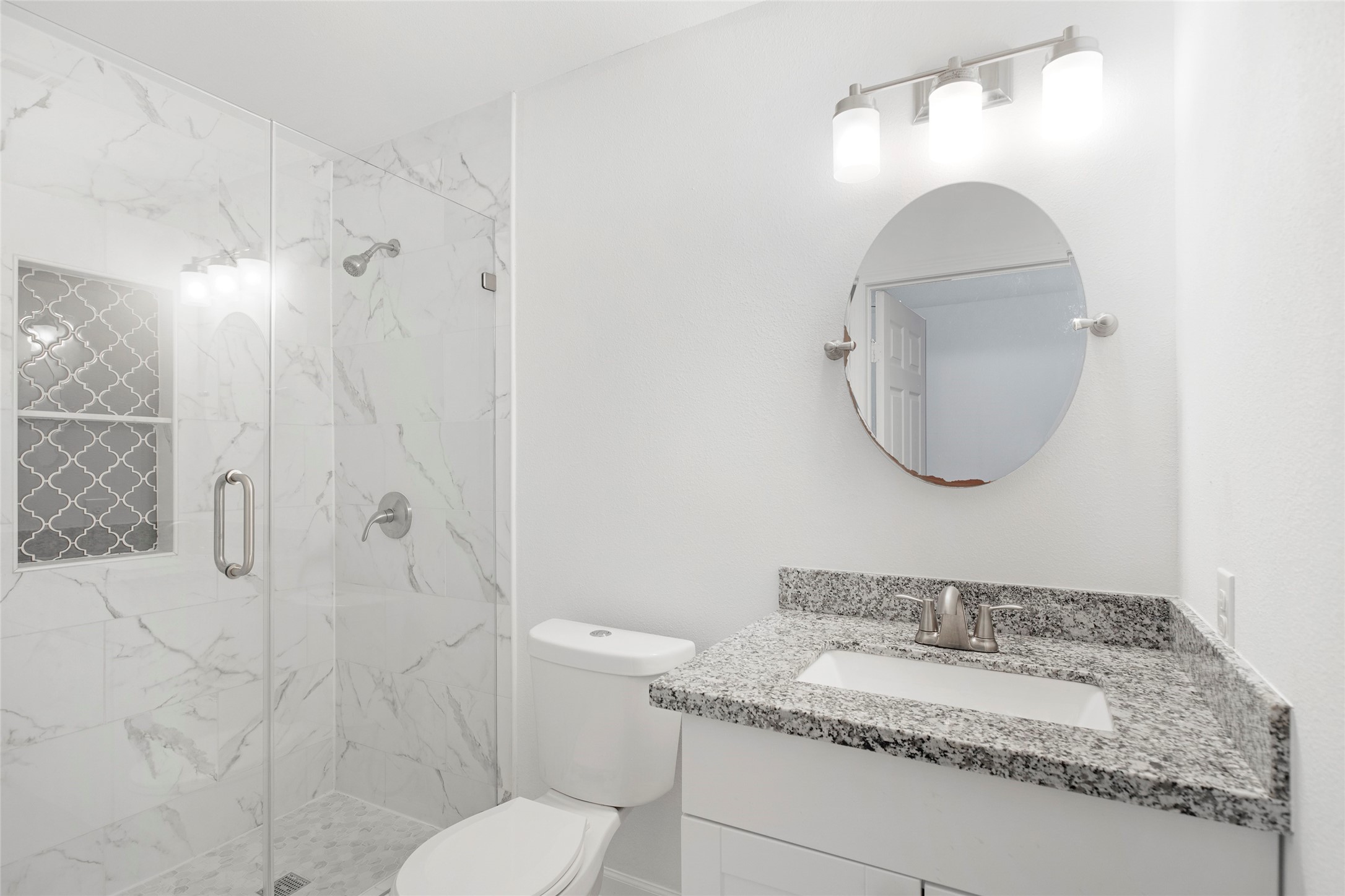 6721 Madrid Street Houston, TX 77021 - Photo 14 of 19 a bathroom with a granite countertop sink toilet and a mirror