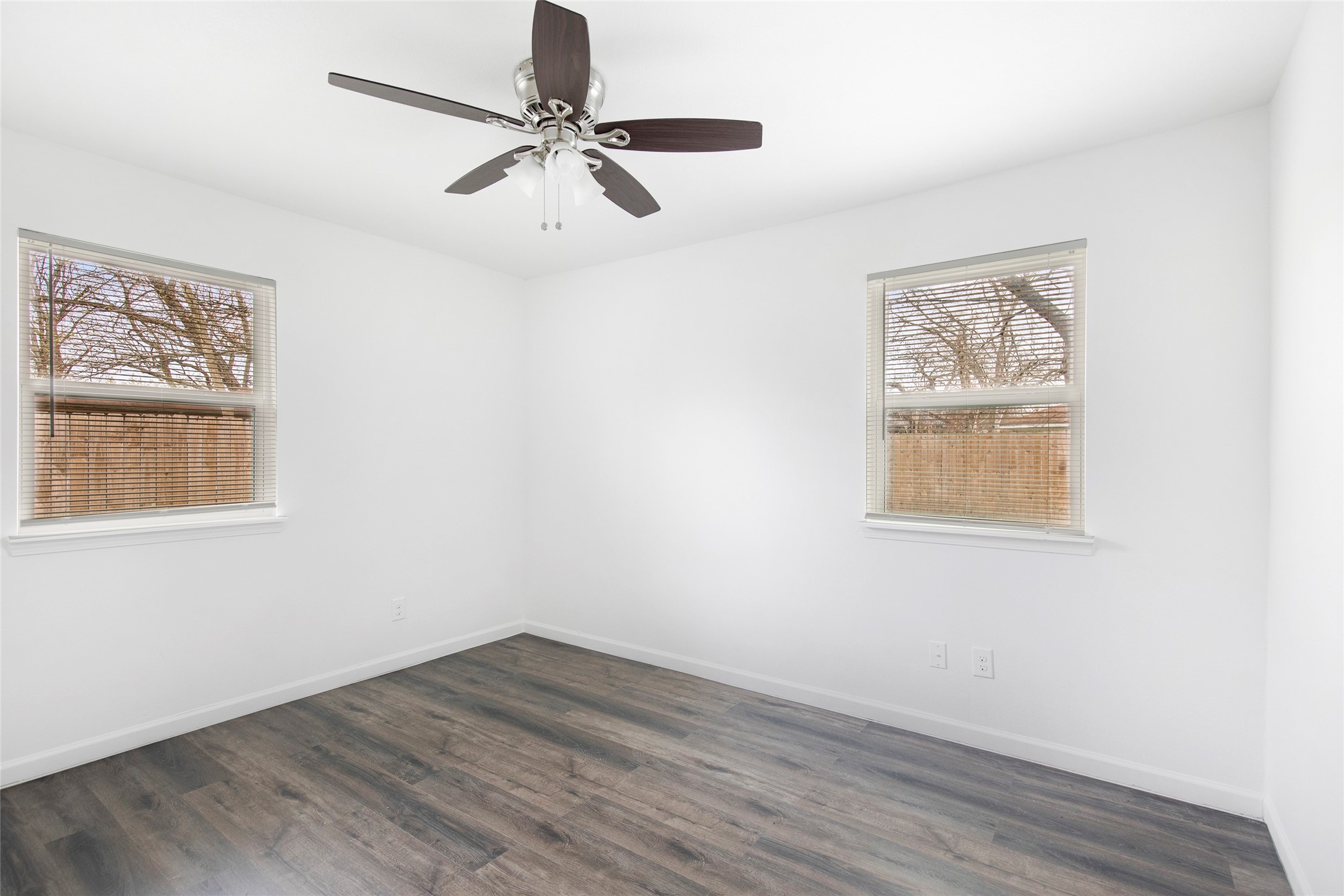 6721 Madrid Street Houston, TX 77021 - Photo 16 of 19 wooden floor in an empty room with a window