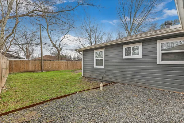 a backyard of a house with lots of green space