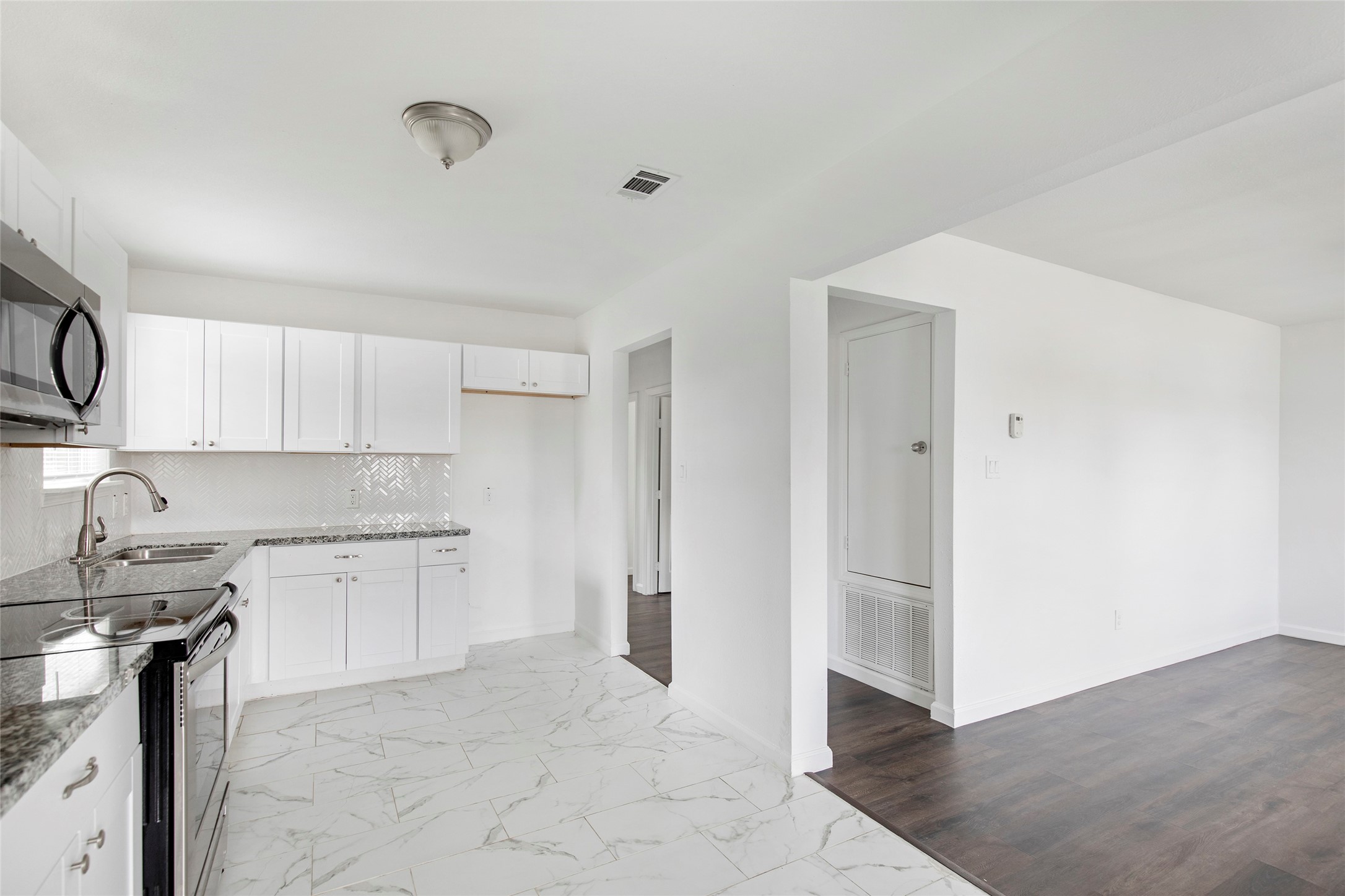6721 Madrid Street Houston, TX 77021 - Photo 10 of 19 a kitchen with a sink cabinets and appliances
