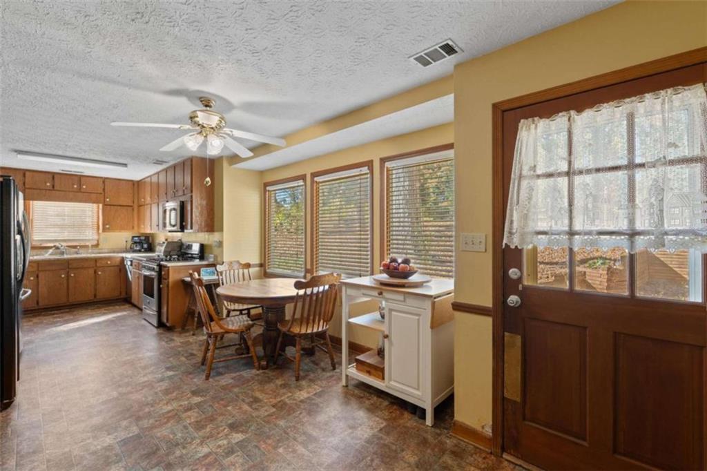 125 Circle Drive Hampton, GA 30228 - Photo 16 of 36 a view of a dining room with furniture window and outside view