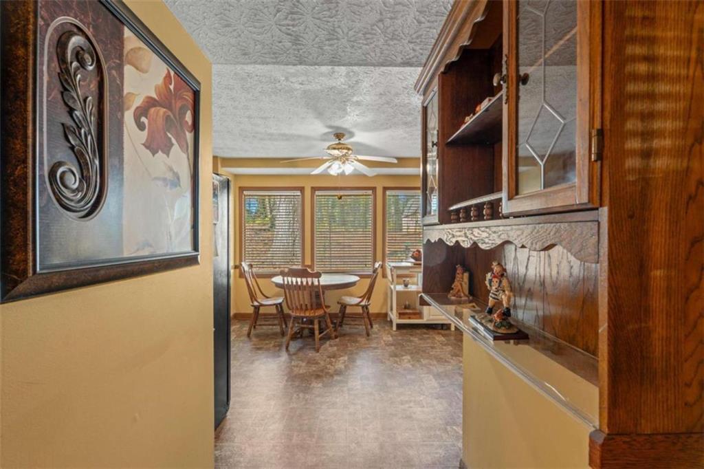 125 Circle Drive Hampton, GA 30228 - Photo 17 of 36 a dining room with furniture and a floor to ceiling window