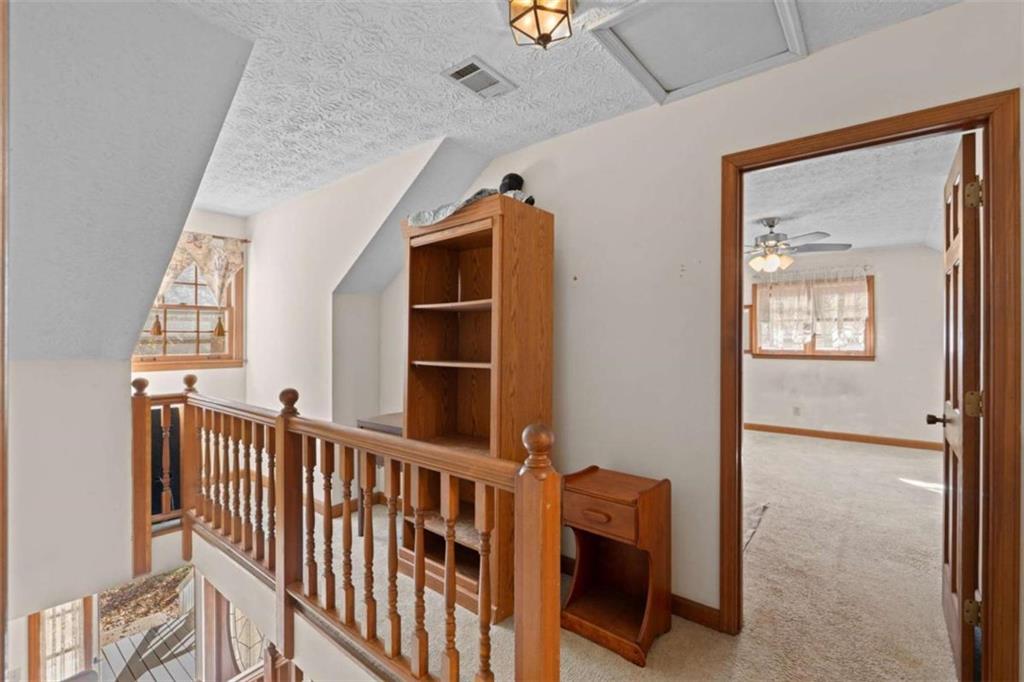 125 Circle Drive Hampton, GA 30228 - Photo 28 of 36 a view of a hallway with windows