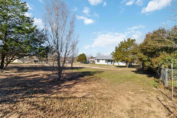 a view of a yard with trees