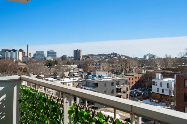 a view of a city skyline from a balcony
