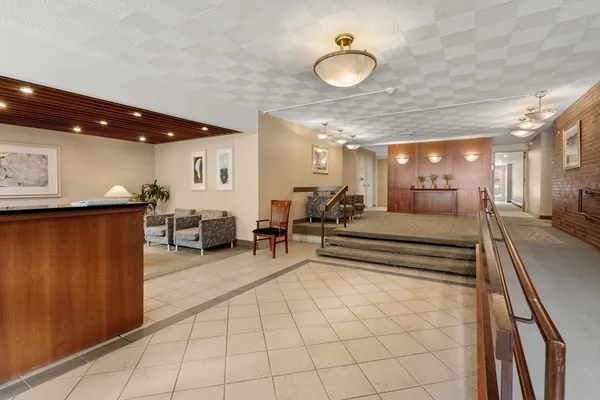a view of a lobby with black carpet