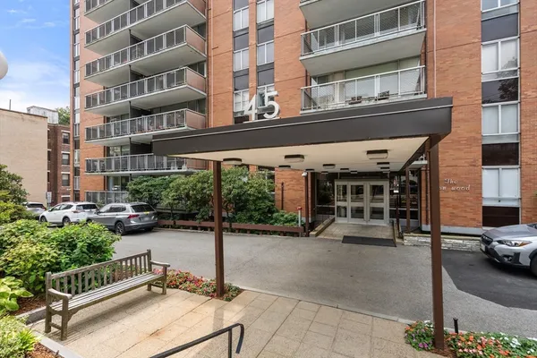 a view of a building with sitting area