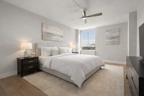 a bedroom with bed and window
