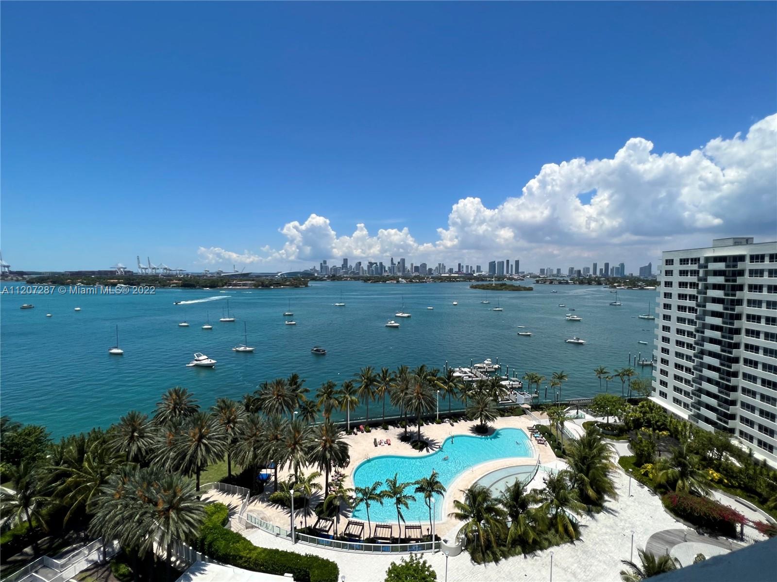 1500 Bay Road, Unit 1414S Miami Beach, FL 33139 - Photo 1 of 23 a view of a lake with a yard