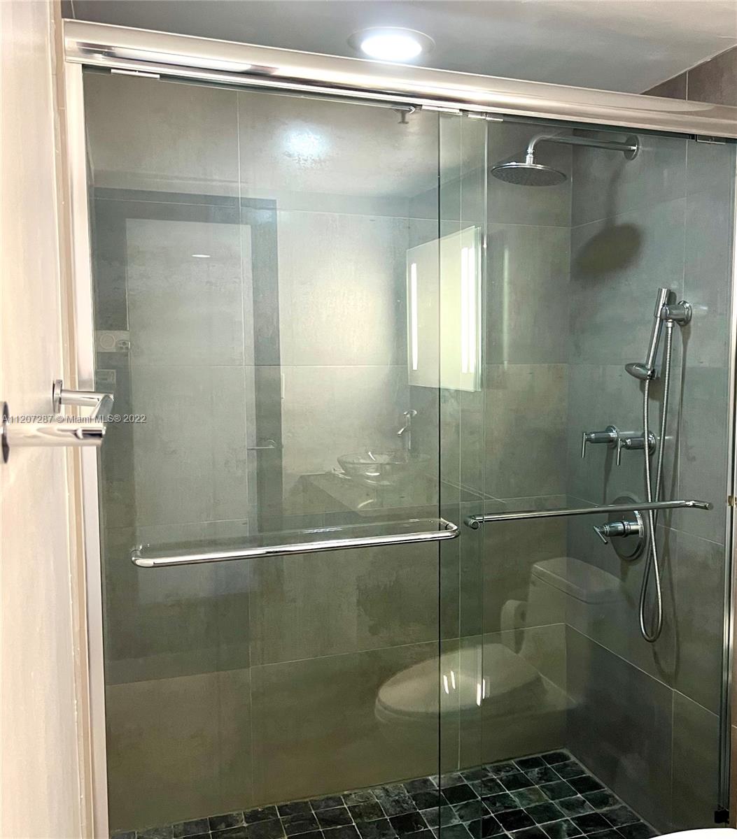 1500 Bay Road, Unit 1414S Miami Beach, FL 33139 - Photo 13 of 23 a bathroom with a shower