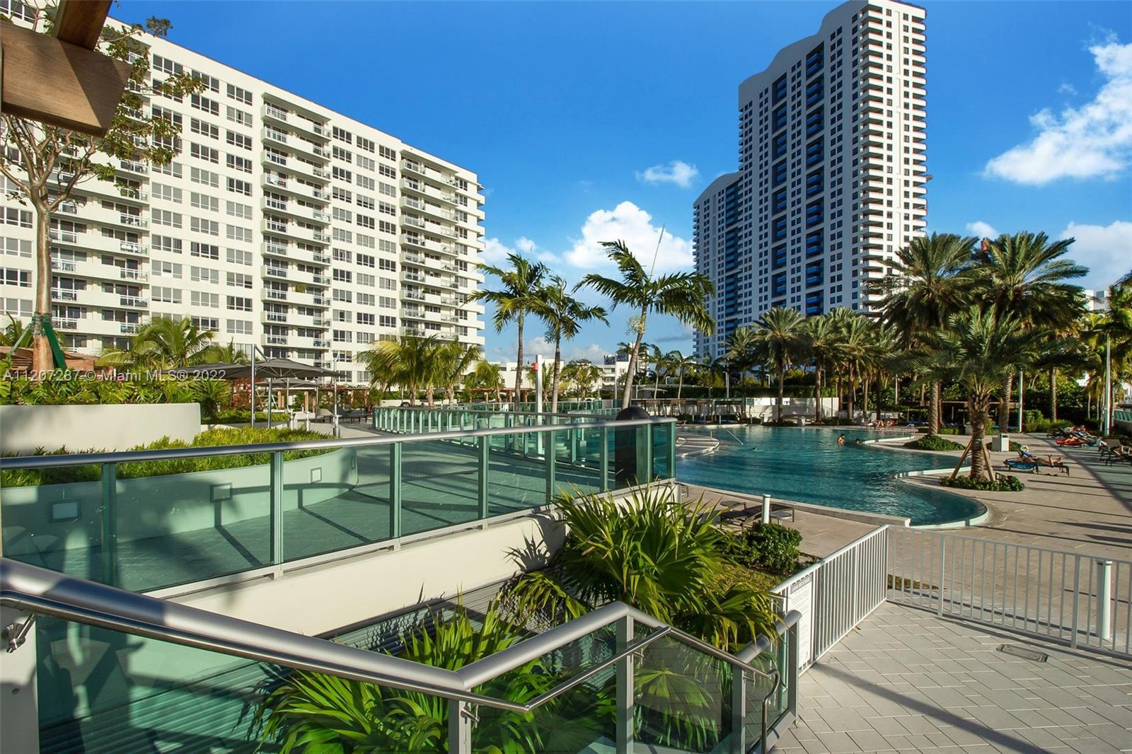 1500 Bay Road, Unit 1414S Miami Beach, FL 33139 - Photo 22 of 23 a view of a chairs and table in the balcony