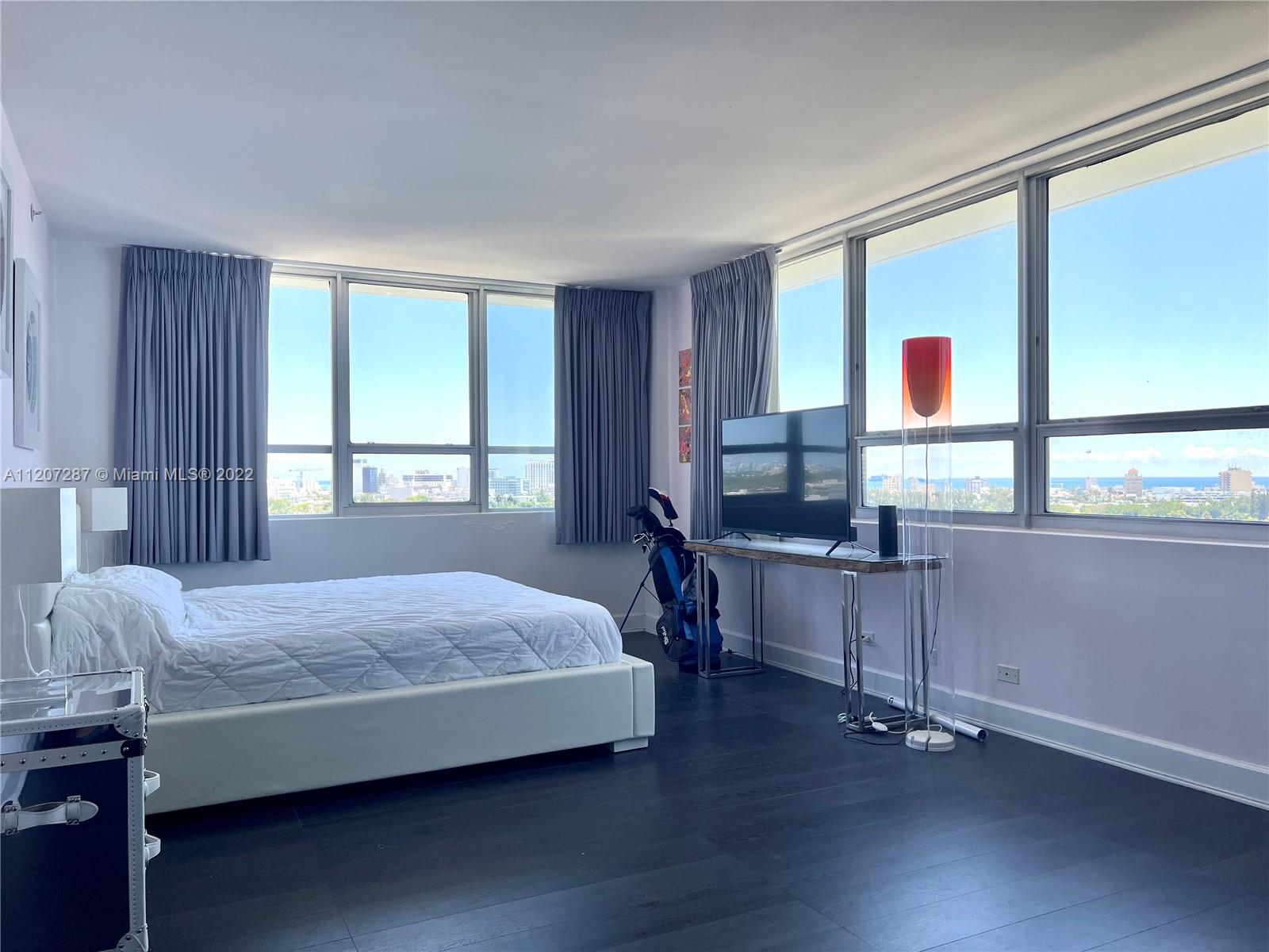 1500 Bay Road, Unit 1414S Miami Beach, FL 33139 - Photo 8 of 23 a bedroom with a bed and a window