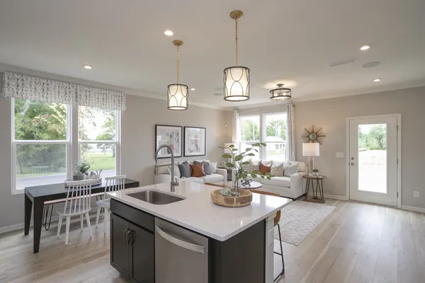 a kitchen with a dining table and chairs