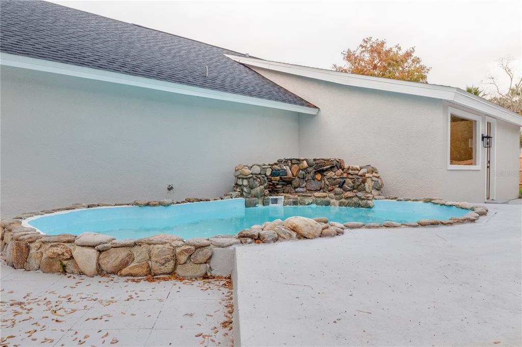 773 Bryant Road Palm Bay, FL 32908 - Photo 11 of 11 a bed room with a bed and a painting on the wall