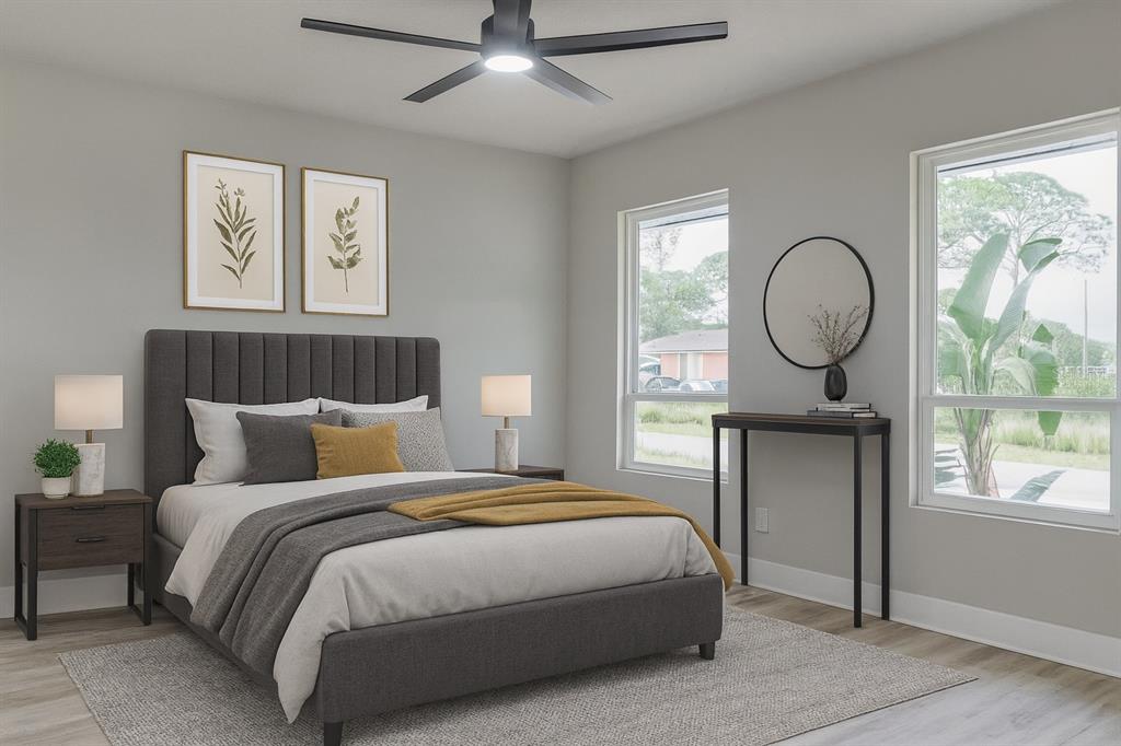 773 Bryant Road Palm Bay, FL 32908 - Photo 6 of 11 a bedroom with a bed a mirror and a large window