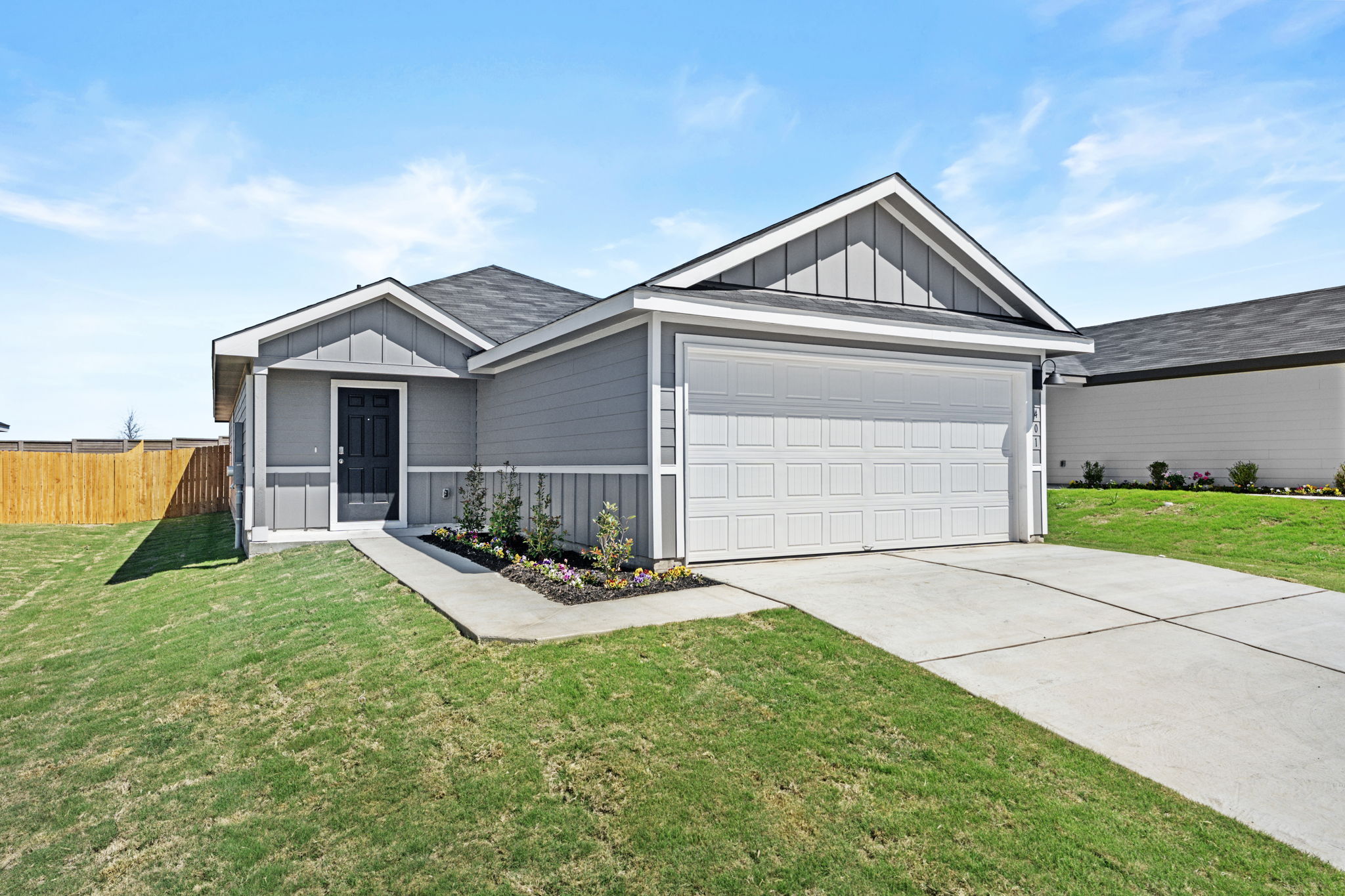 401 Wild Goose Drive Luling, TX 78648 - Photo 1 of 26 a front view of a house with yard and garage