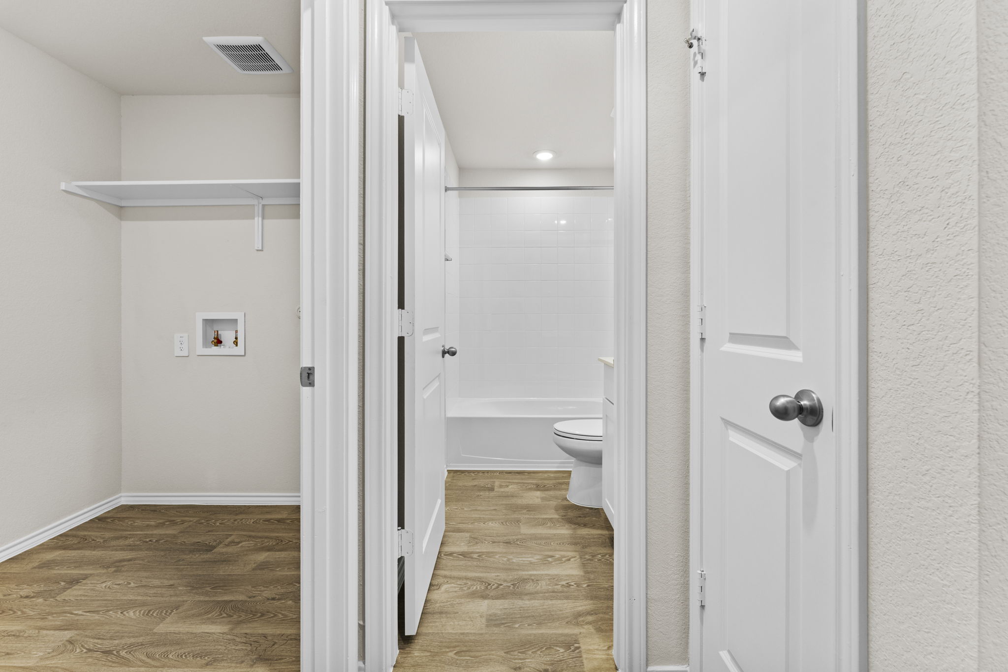 401 Wild Goose Drive Luling, TX 78648 - Photo 14 of 26 a view of a bathroom from a hallway