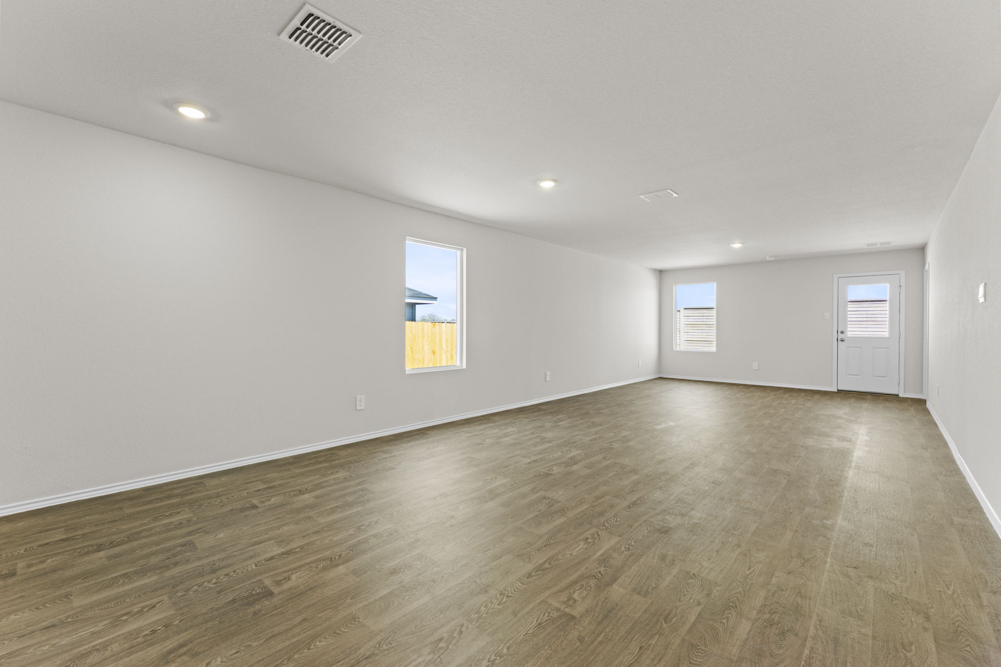 401 Wild Goose Drive Luling, TX 78648 - Photo 17 of 26 wooden floor in an empty room with a window
