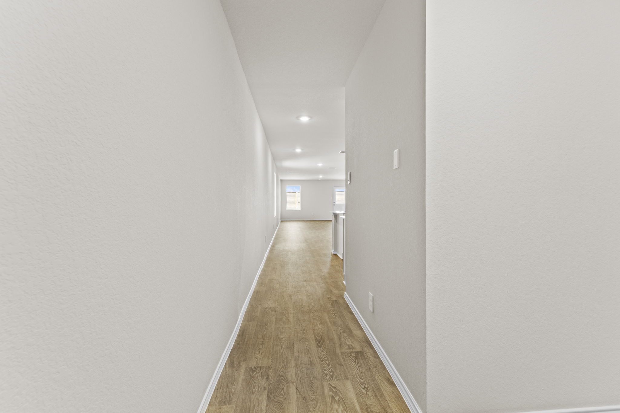401 Wild Goose Drive Luling, TX 78648 - Photo 2 of 26 a view of a hallway with wooden floor
