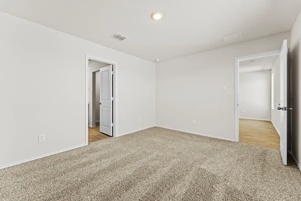 an empty room with a bathroom