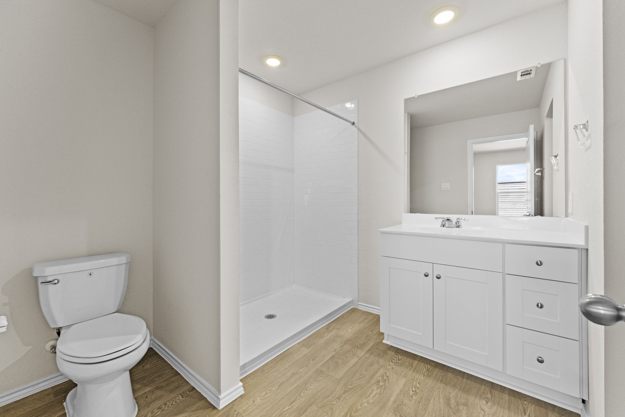 401 Wild Goose Drive Luling, TX 78648 - Photo 23 of 26 a bathroom with a shower a sink a toilet and mirror
