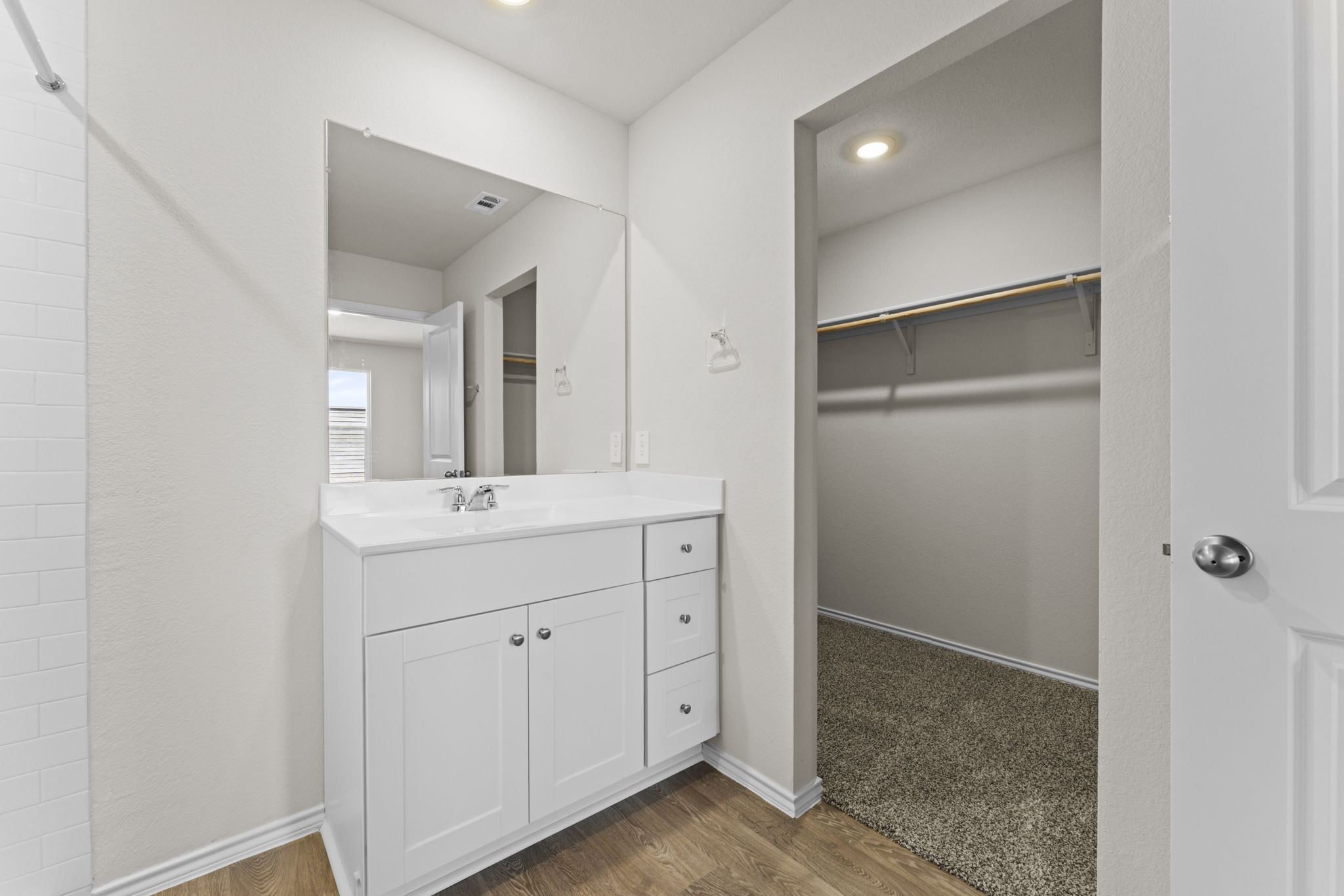401 Wild Goose Drive Luling, TX 78648 - Photo 24 of 26 a bathroom with a sink a light fixture a vanity and a mirror