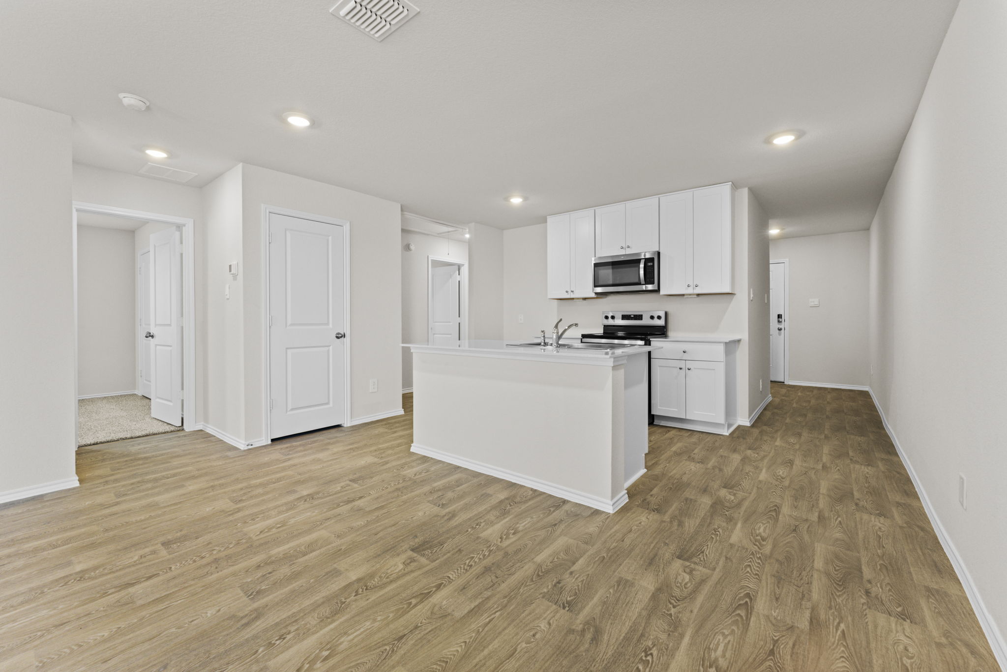 401 Wild Goose Drive Luling, TX 78648 - Photo 5 of 26 a kitchen with stainless steel appliances granite countertop a stove a sink and a refrigerator