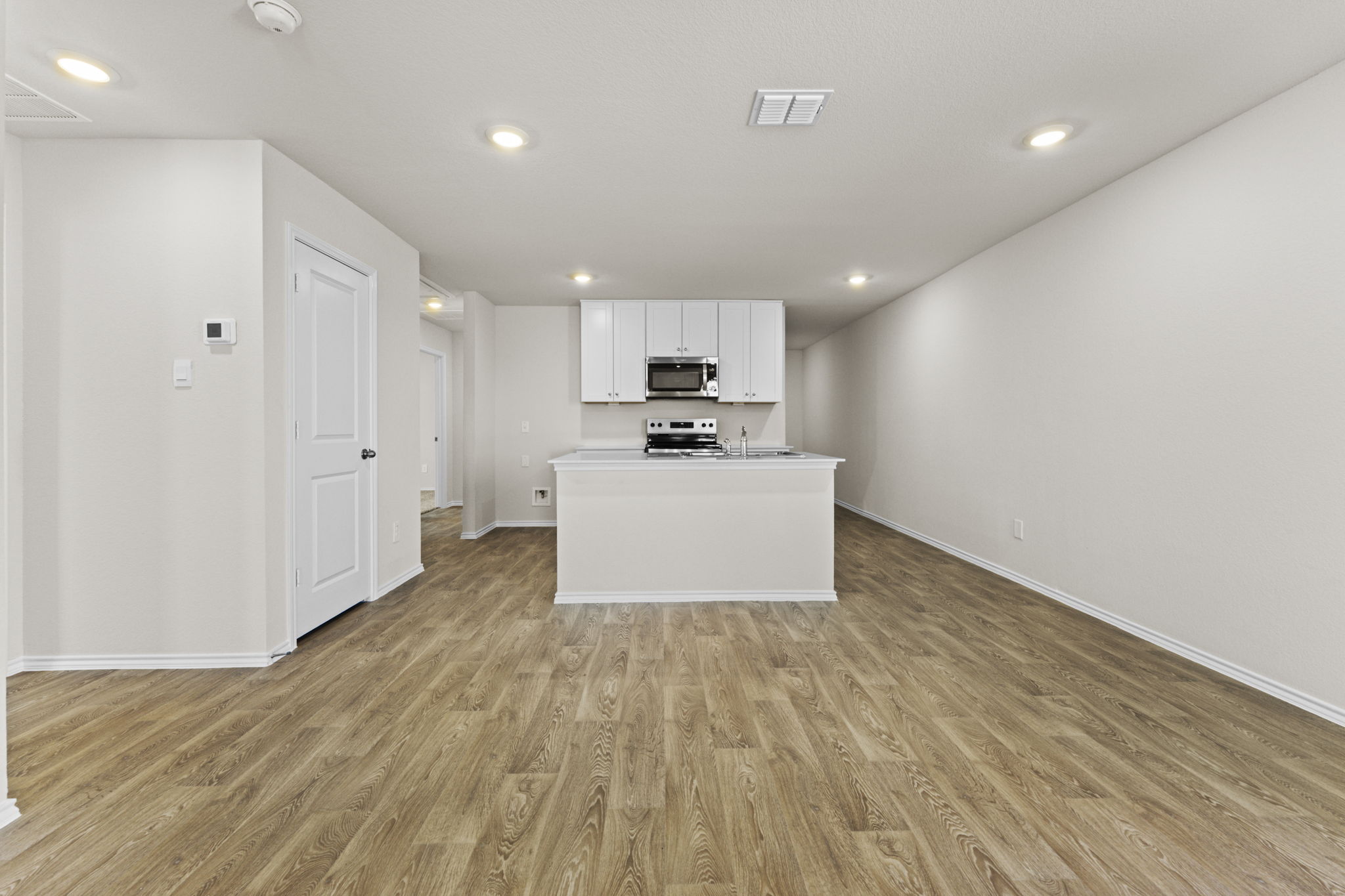 401 Wild Goose Drive Luling, TX 78648 - Photo 6 of 26 a kitchen with granite countertop a sink and a stove top oven