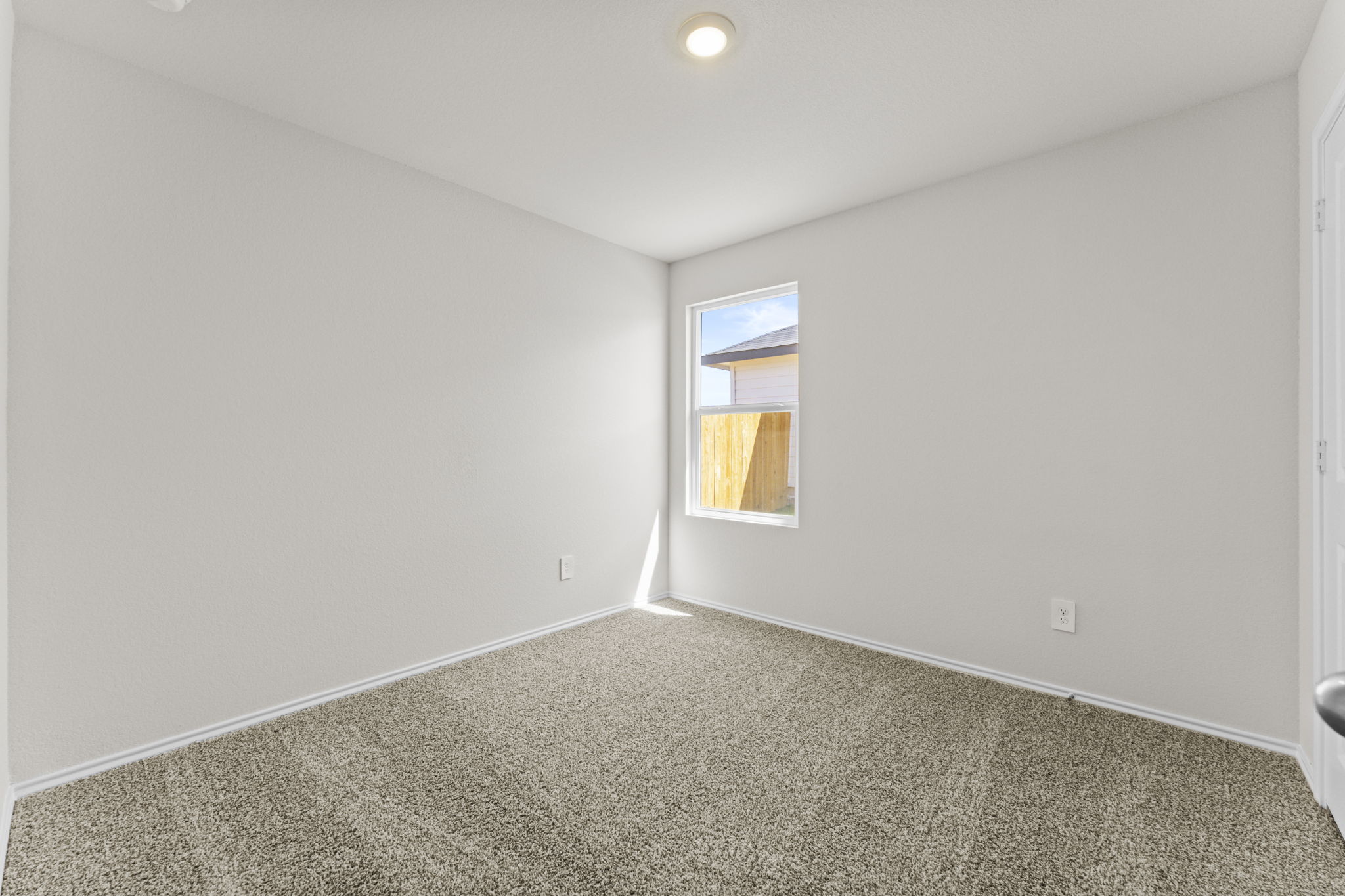 401 Wild Goose Drive Luling, TX 78648 - Photo 7 of 26 a view of an empty room and a window
