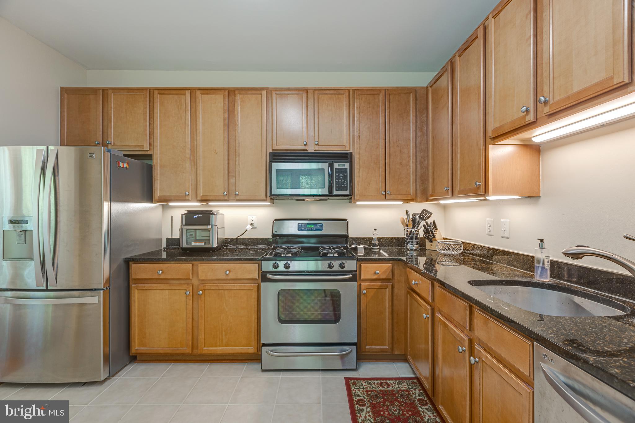 1511 North Point Drive, Unit 303 Reston, VA 20194 - Photo 12 of 29 Easy care kitchen flooring
