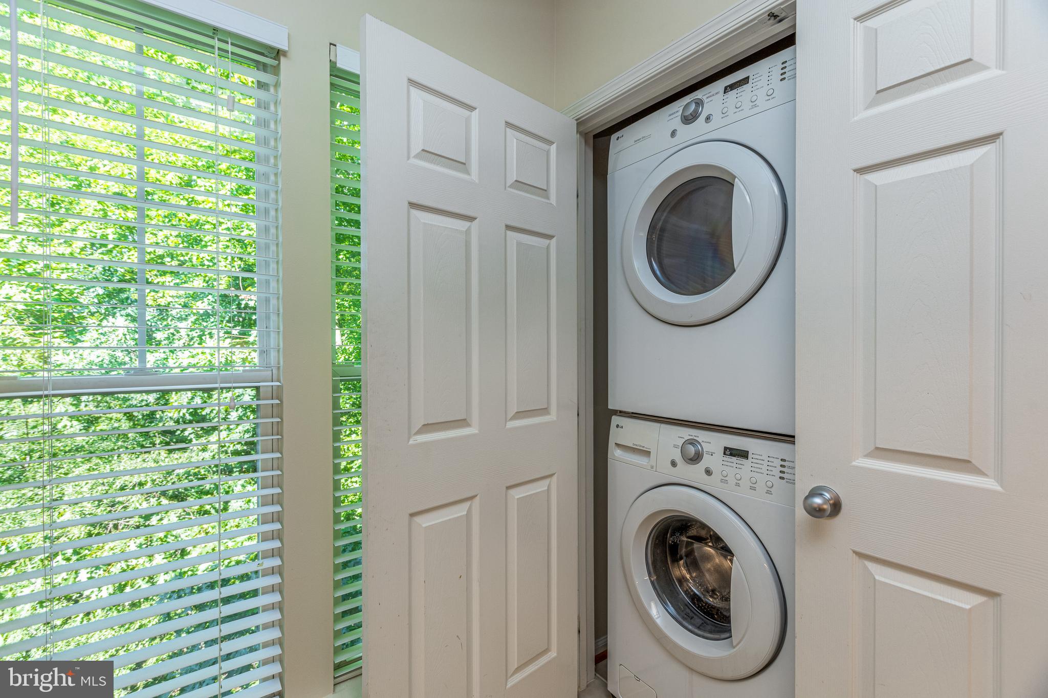 1511 North Point Drive, Unit 303 Reston, VA 20194 - Photo 15 of 29 Washer and dryer hidden nicely in the kitchen