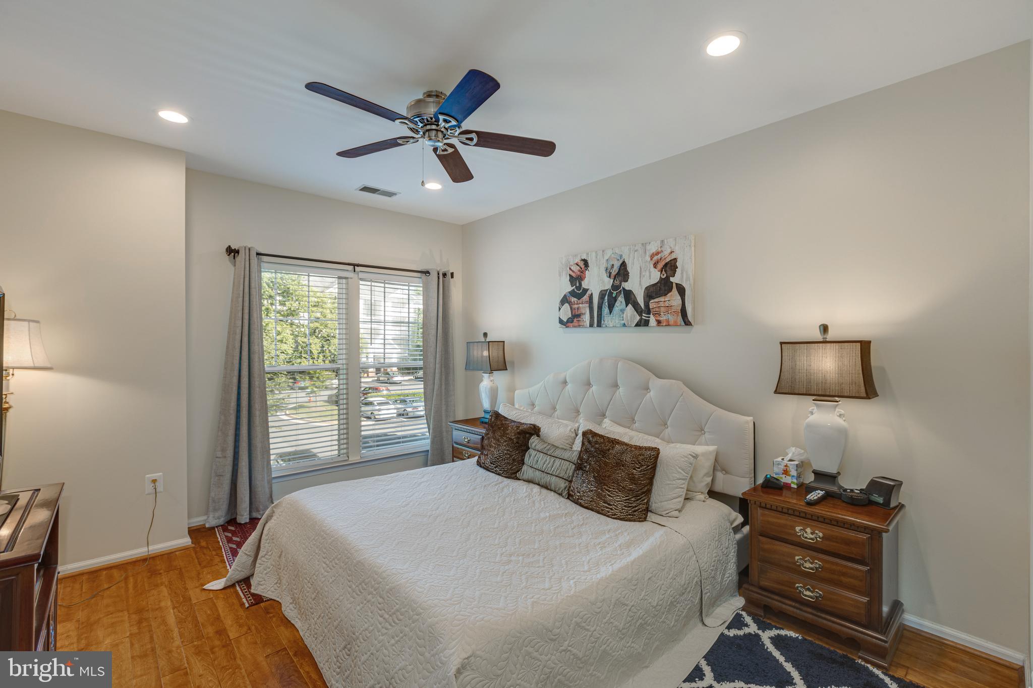 1511 North Point Drive, Unit 303 Reston, VA 20194 - Photo 16 of 29 Primary bedroom with recessed LED lighting and fan