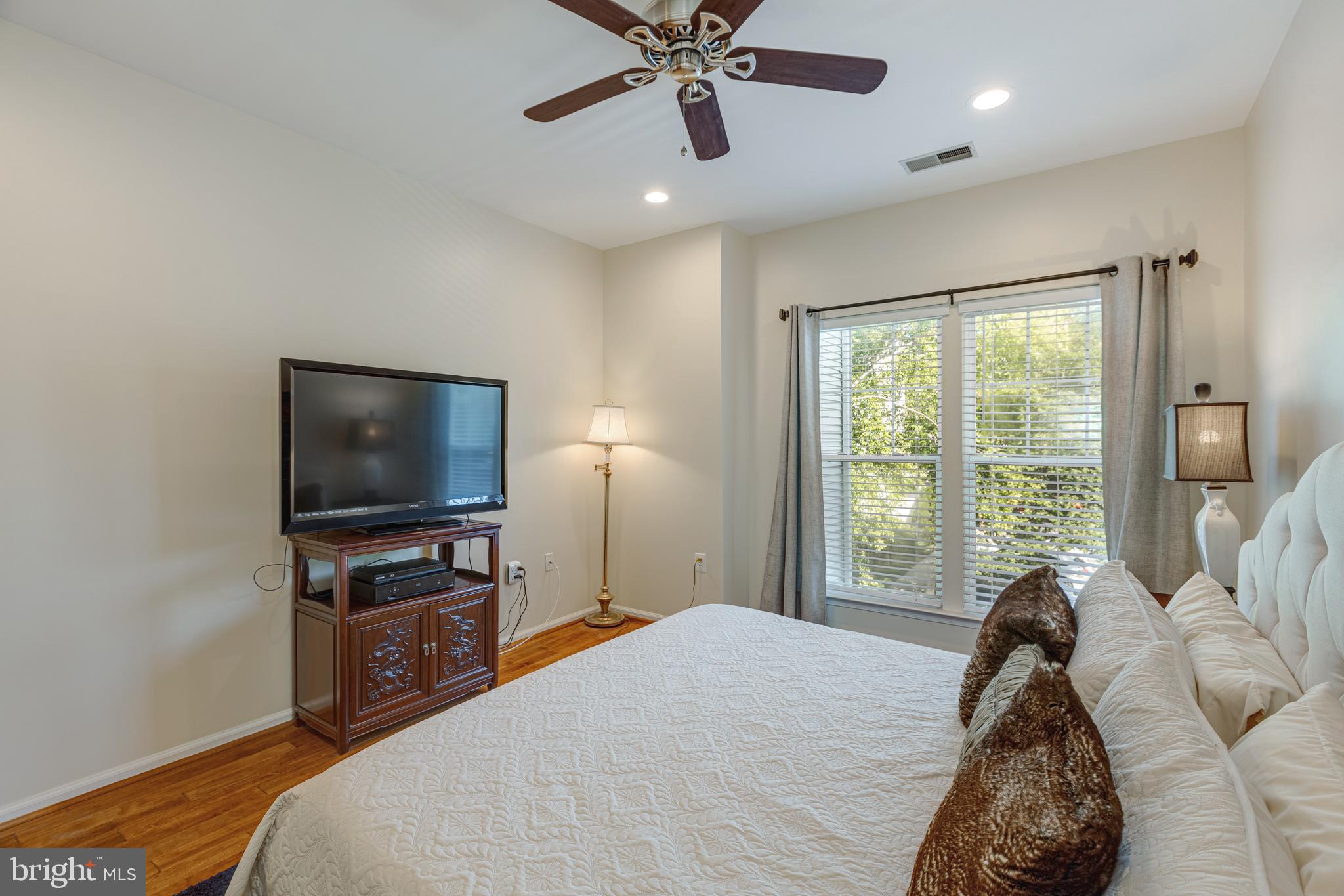 1511 North Point Drive, Unit 303 Reston, VA 20194 - Photo 17 of 29 Tree top view from the primary bedroom