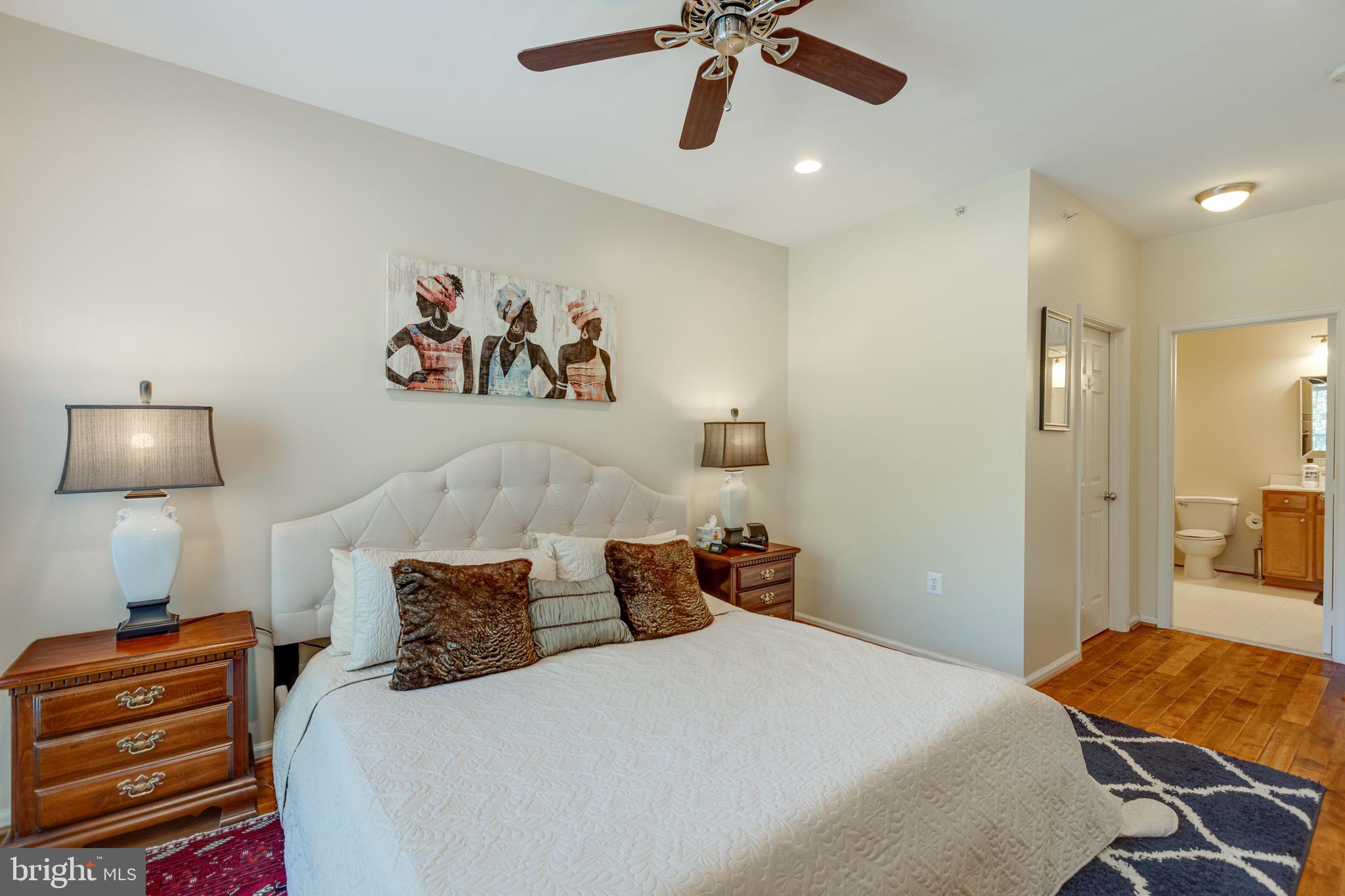 1511 North Point Drive, Unit 303 Reston, VA 20194 - Photo 18 of 29 Primary bedroom has a large walk in closet