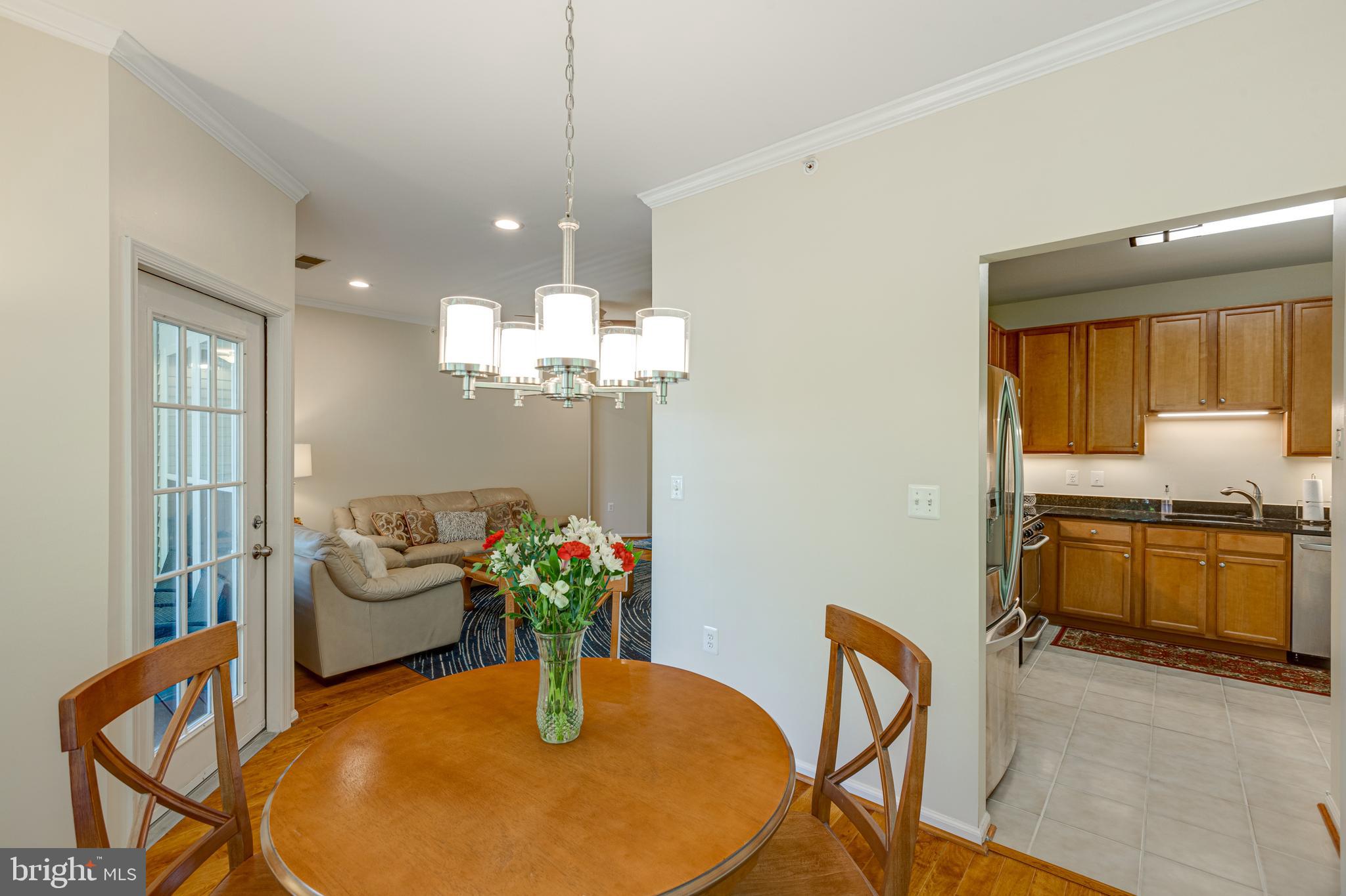 1511 North Point Drive, Unit 303 Reston, VA 20194 - Photo 9 of 29 Dining room looking into the kitchen