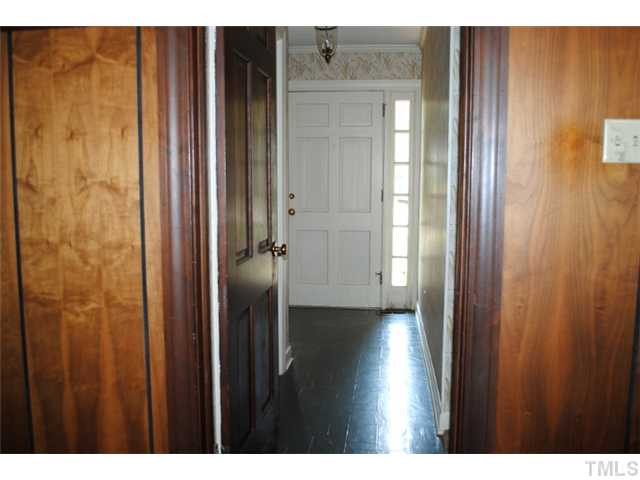 2039 Brogden Road Smithfield, NC 27577 - Photo 18 of 19 Here's a view of the front door and entry hall (foyer) from the family room. The entry hall has a coat closet. Foyer