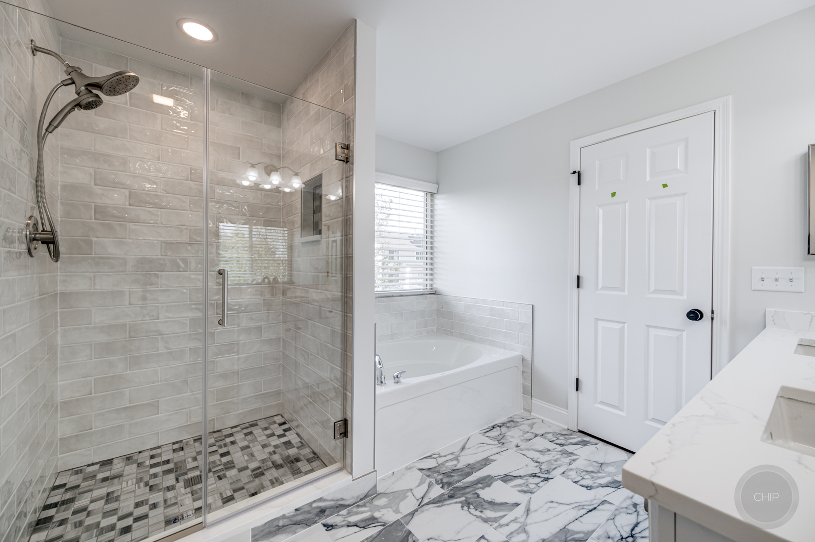 12948 Parterre Place Plainfield, IL 60585 - Photo 29 of 35 a bathroom with a bathtub and a shower