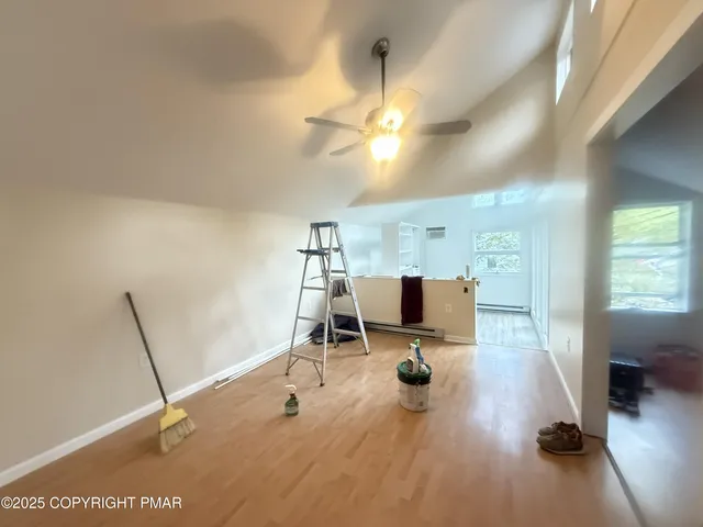 a view of a workspace with furniture and a chandelier