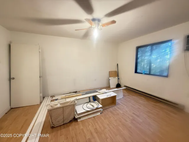 a room with furniture and wooden floor
