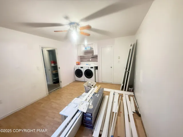 a view of kitchen with a sink and wooden floor