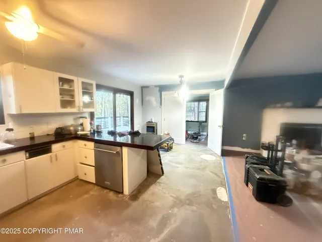a kitchen with sink and cabinets